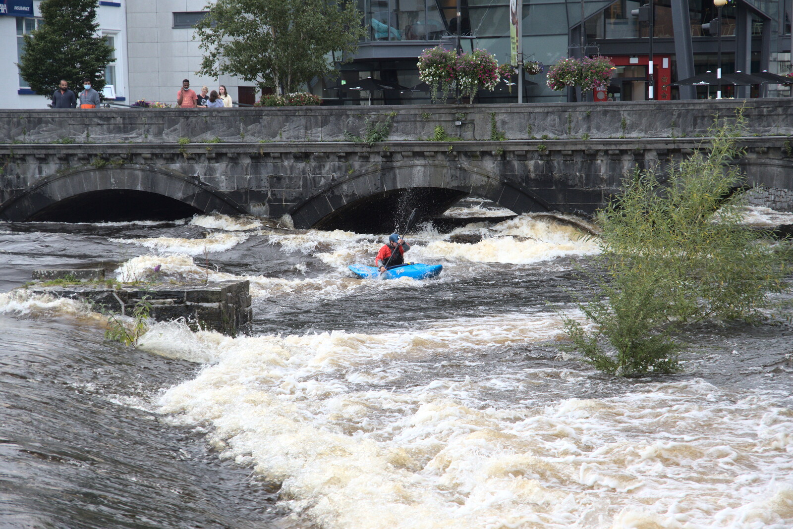 Pints of Guinness and Streedagh Beach, Grange and Sligo, Ireland - 9th August 2021: Some insaniac is actually kayaking the river