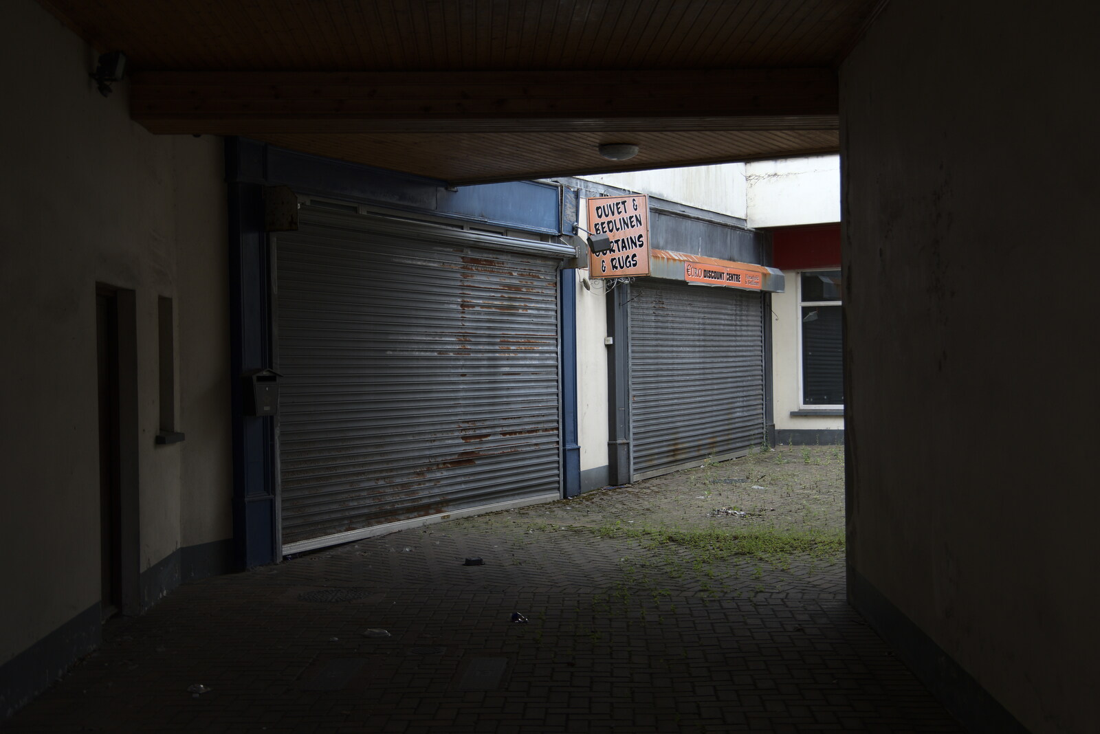 A Trip to Manorhamilton, County Leitrim, Ireland - 11th August 2021: Permanent shutters on a bedding shop