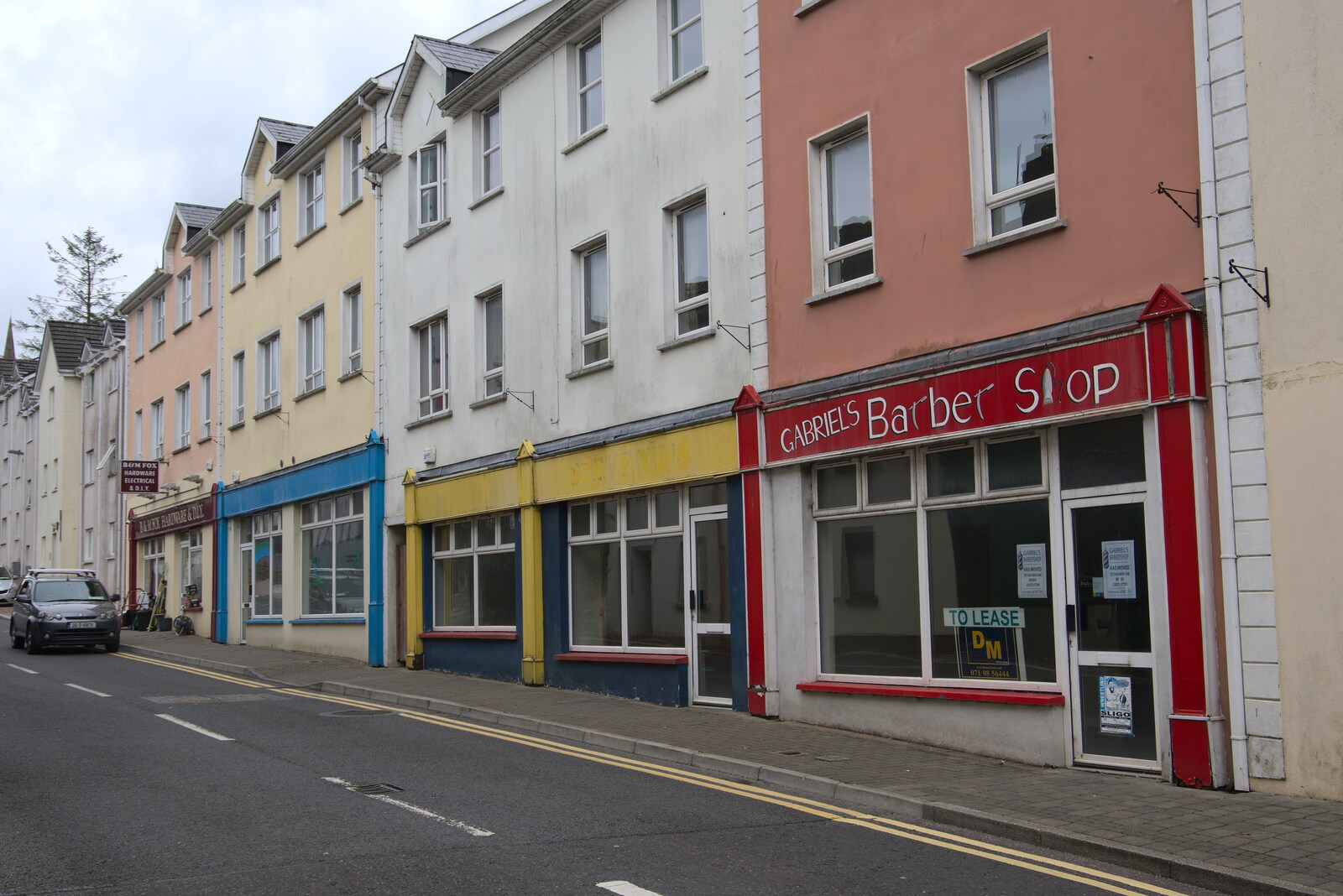 A Trip to Manorhamilton, County Leitrim, Ireland - 11th August 2021: Empty shops on Temple Lane