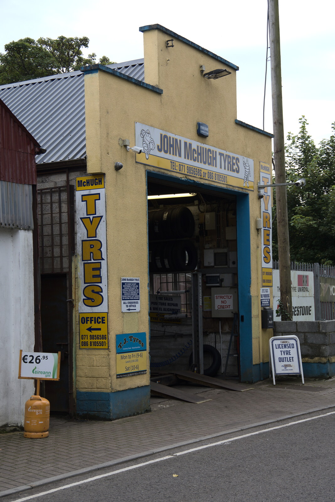 A Trip to Manorhamilton, County Leitrim, Ireland - 11th August 2021: Old-school John McHugh Tyres