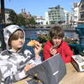 2021 The boys scoff doughnuts by the river