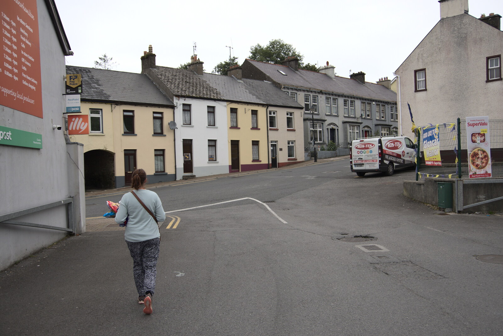 Isobel walks off with some bags of Tayto from Manorhamilton and the Street Art of Dún Laoghaire, Ireland - 15th August 2021