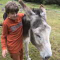 2021 Fred has a go with the donkey hugging