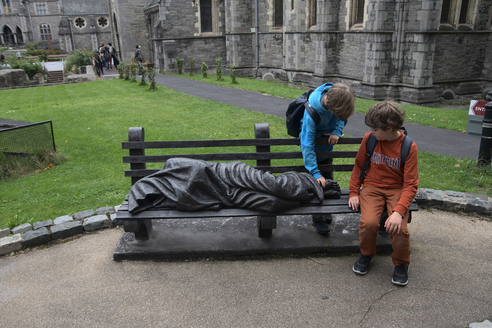 The boys poke a statue on a bench from A Trip to Noddy's, and Dublin City Centre, Wicklow and Dublin, Ireland - 16th August 2021