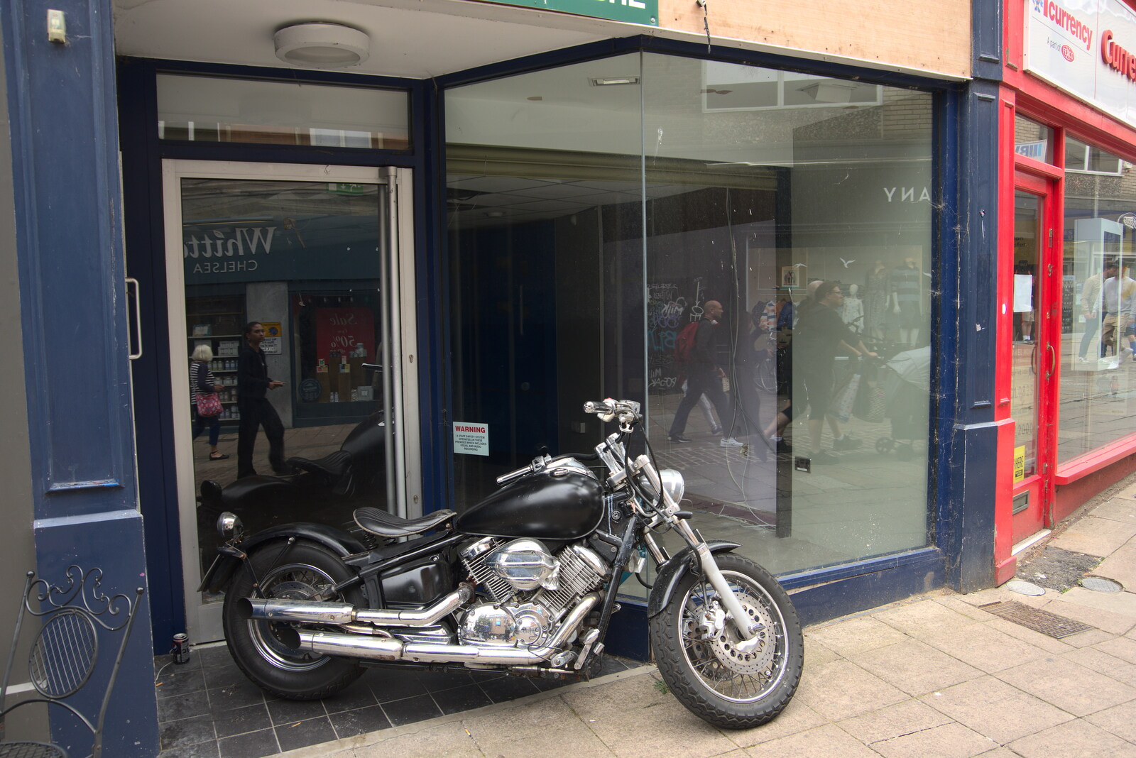 There's a motorbike outside an empty shop from Dippy and the City Dinosaur Trail, Norwich, Norfolk - 19th August 2021