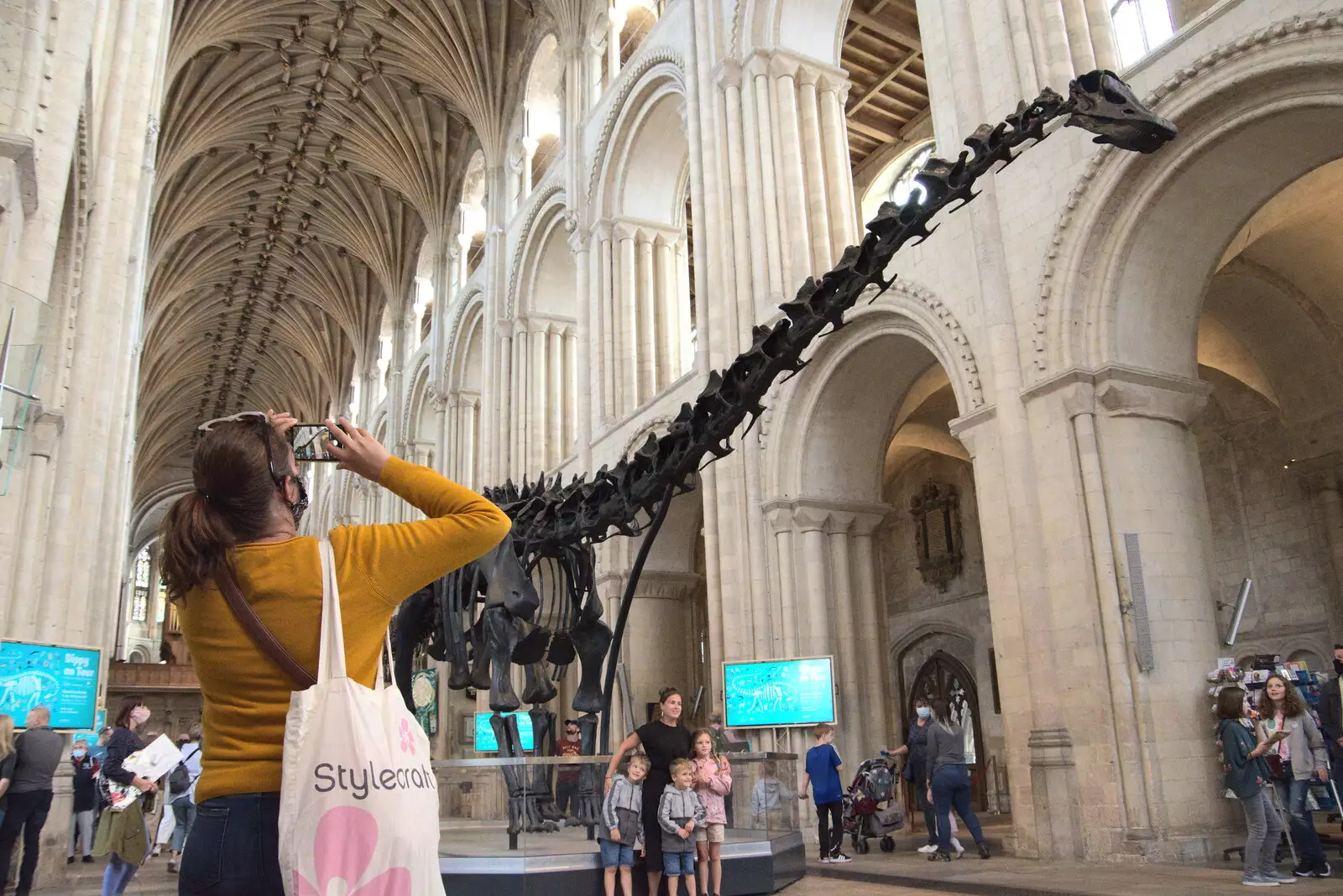 Isobel gets a photo, from Dippy and the City Dinosaur Trail, Norwich, Norfolk - 19th August 2021