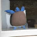 2021 A knitted turtle in a window