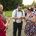 Petay and Isobel do some phone tech stuff, Petay's Wedding Reception, Fanhams Hall, Ware, Hertfordshire - 20th August 2021