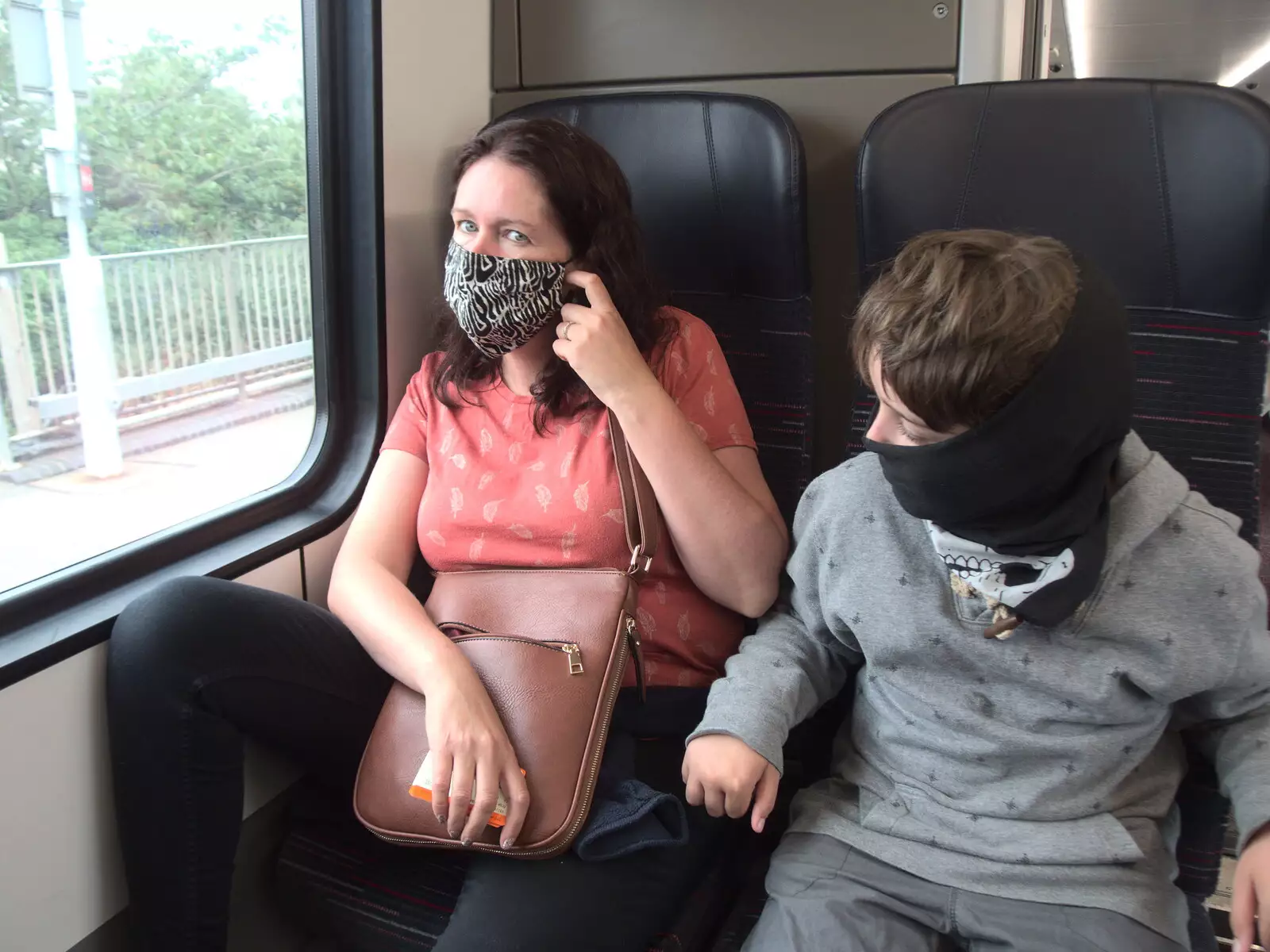 Isobel and Fred on the train to Norwich, from Head Out Not Home: A Music Day, Norwich, Norfolk - 22nd August 2021