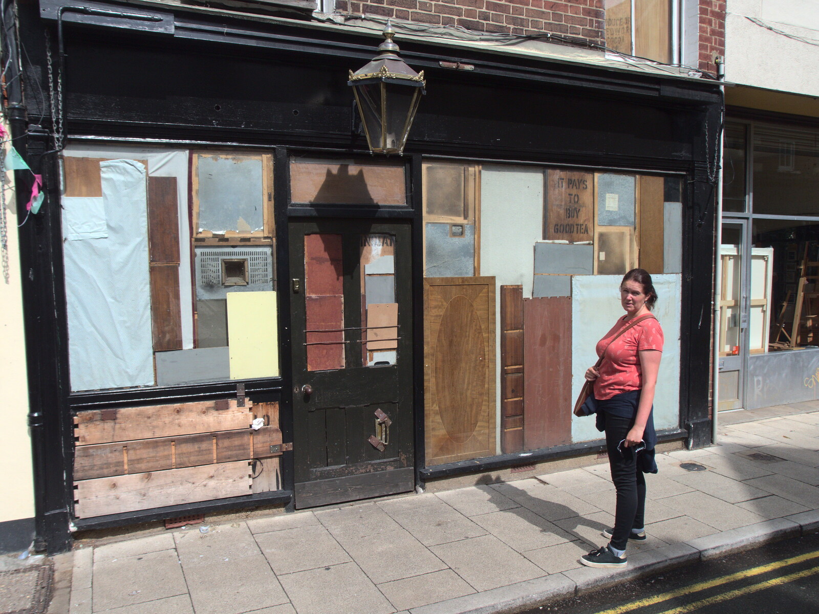 Isobel outside a boarded-up shop from Head Out Not Home: A Music Day, Norwich, Norfolk - 22nd August 2021