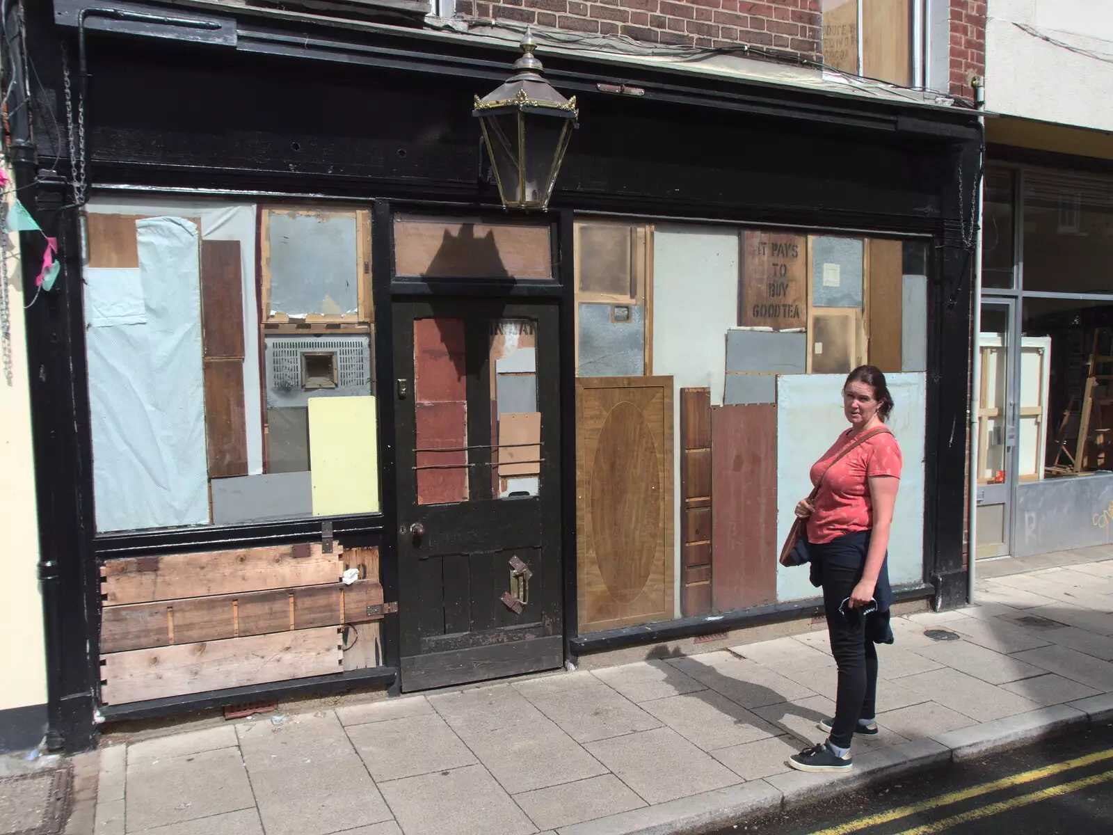 Isobel outside a boarded-up shop, from Head Out Not Home: A Music Day, Norwich, Norfolk - 22nd August 2021