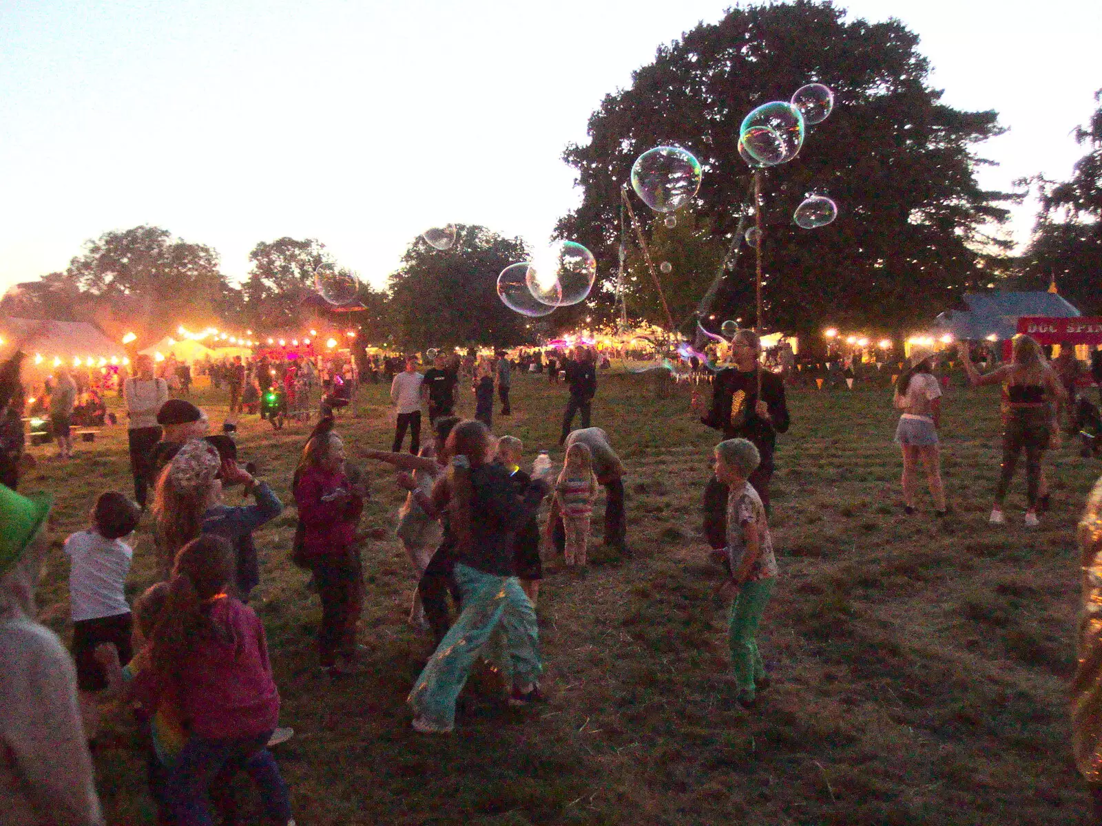 Children chase bubbles around, from Maui Waui Festival, Hill Farm, Gressenhall, Norfolk - 28th August 2021