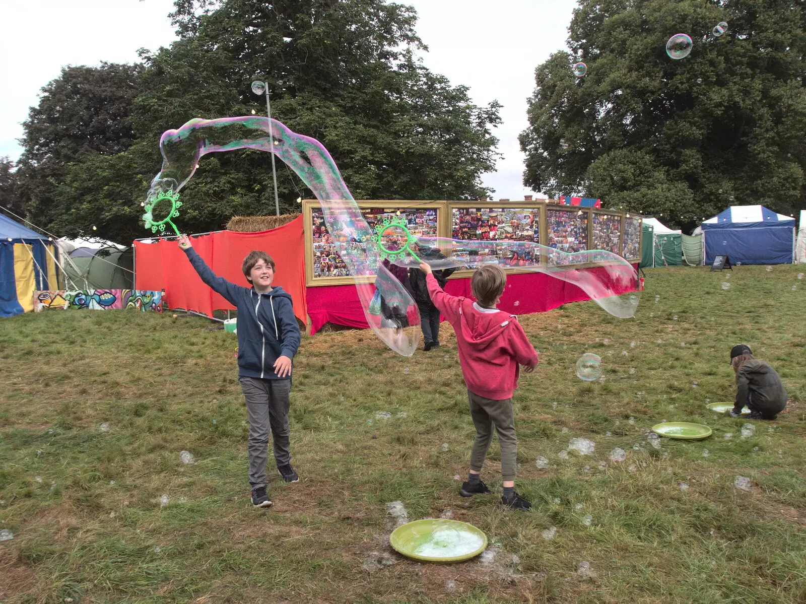 The boys make long bubbles, from Maui Waui Festival, Hill Farm, Gressenhall, Norfolk - 28th August 2021