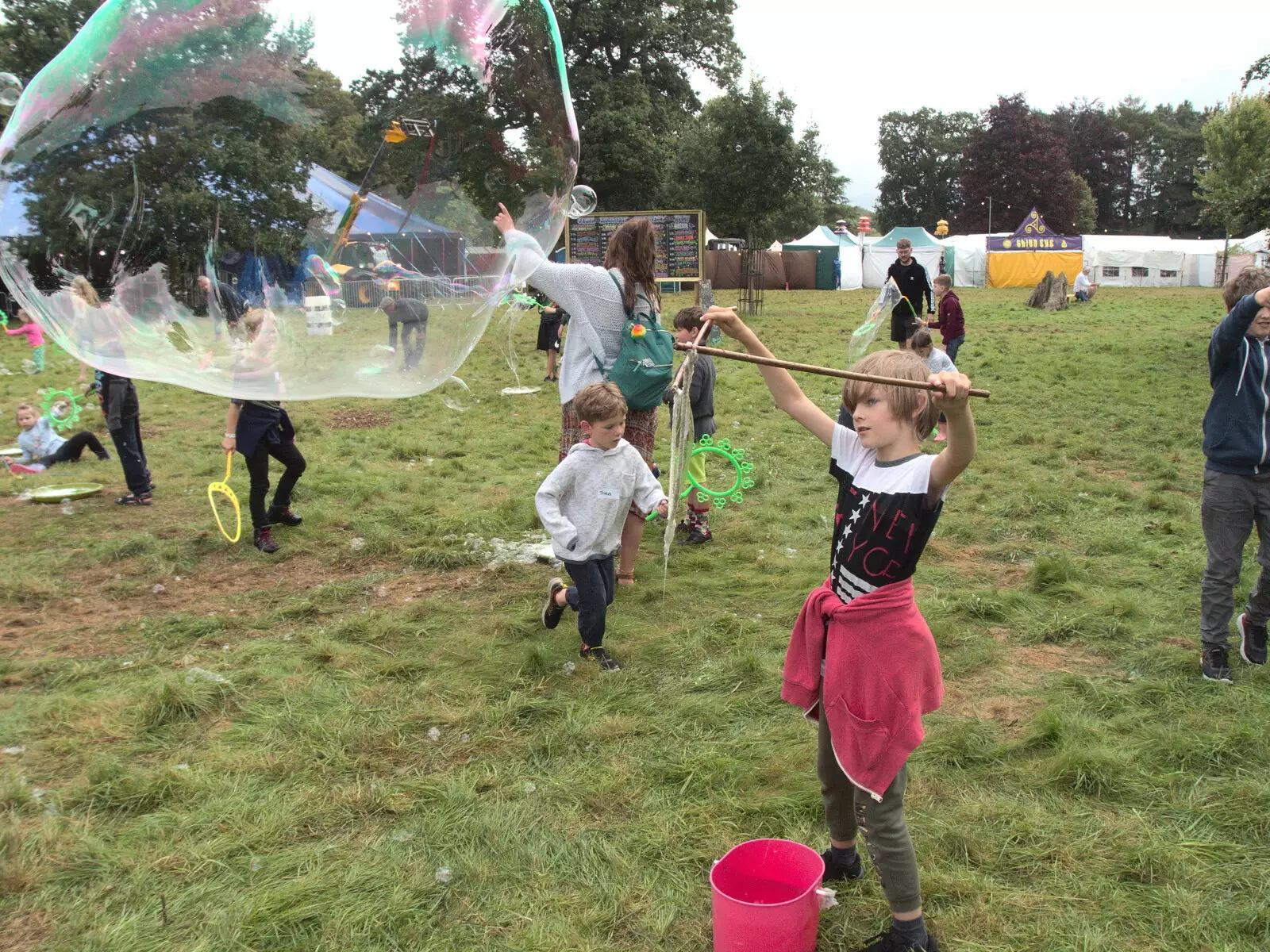 Harry makes a huge bubble, from Maui Waui Festival, Hill Farm, Gressenhall, Norfolk - 28th August 2021