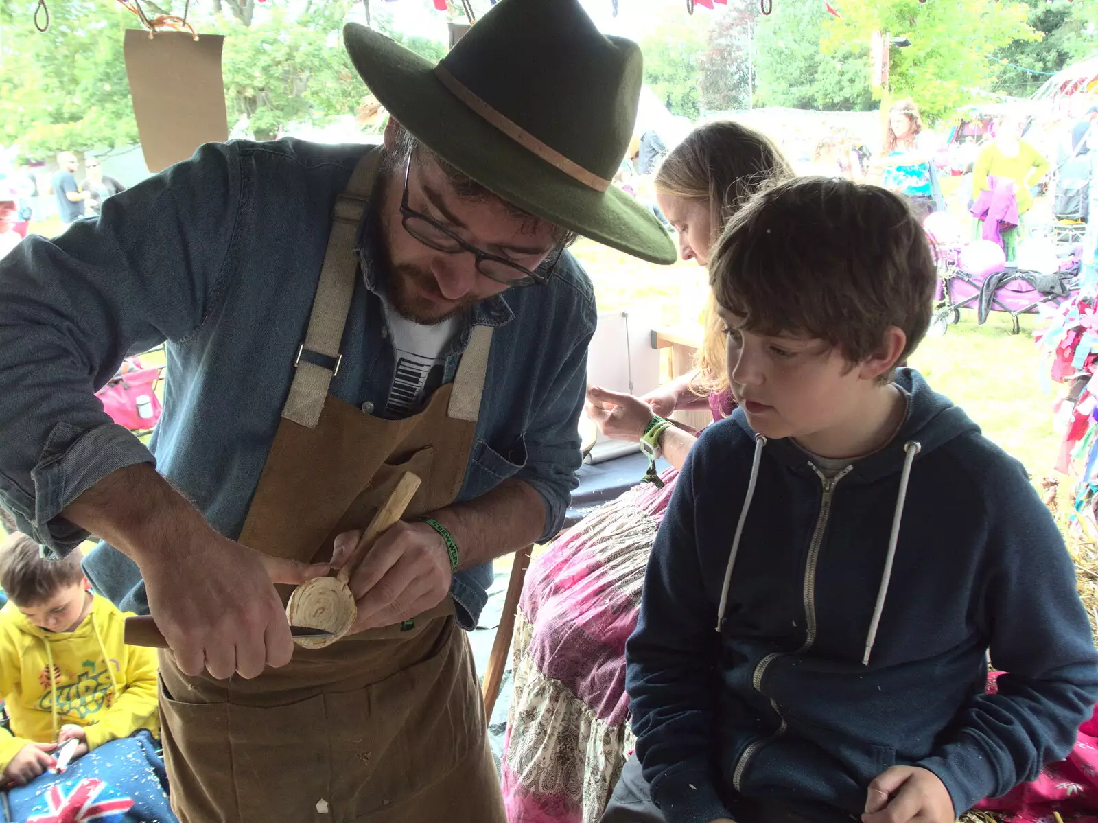 Fred learns some carving techniques, from Maui Waui Festival, Hill Farm, Gressenhall, Norfolk - 28th August 2021