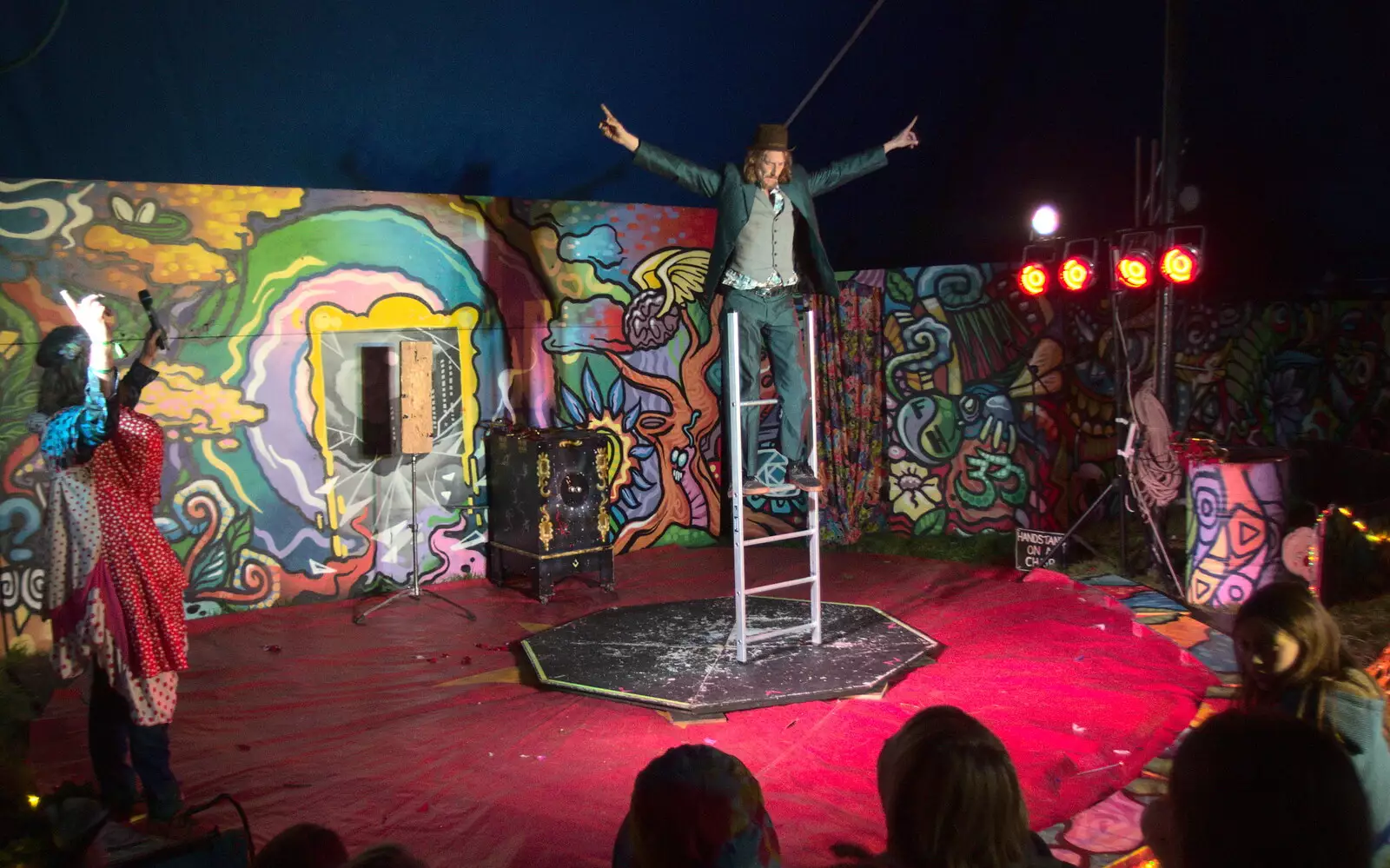 A dude balances on a ladder, from Maui Waui Festival, Hill Farm, Gressenhall, Norfolk - 28th August 2021