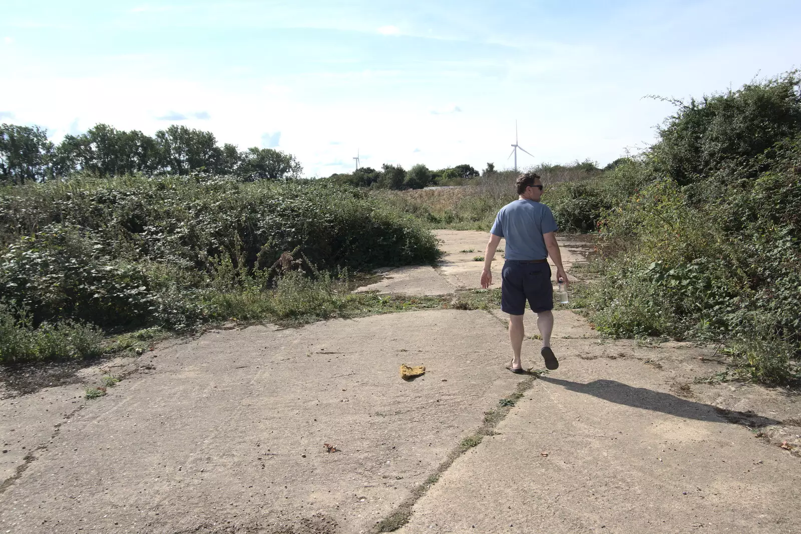 Clive checks out where one of the mess halls was, from A Summer Party and an Airfield Walk with Clive, Brome, Suffolk - 11th September 2021