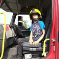 Harry has a go in the fire engine, The Brome and Oakley Fête, Oakley Hall, Suffolk - 19th September 2021