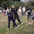 The other fireman enters the grass-skiing event, The Brome and Oakley Fête, Oakley Hall, Suffolk - 19th September 2021