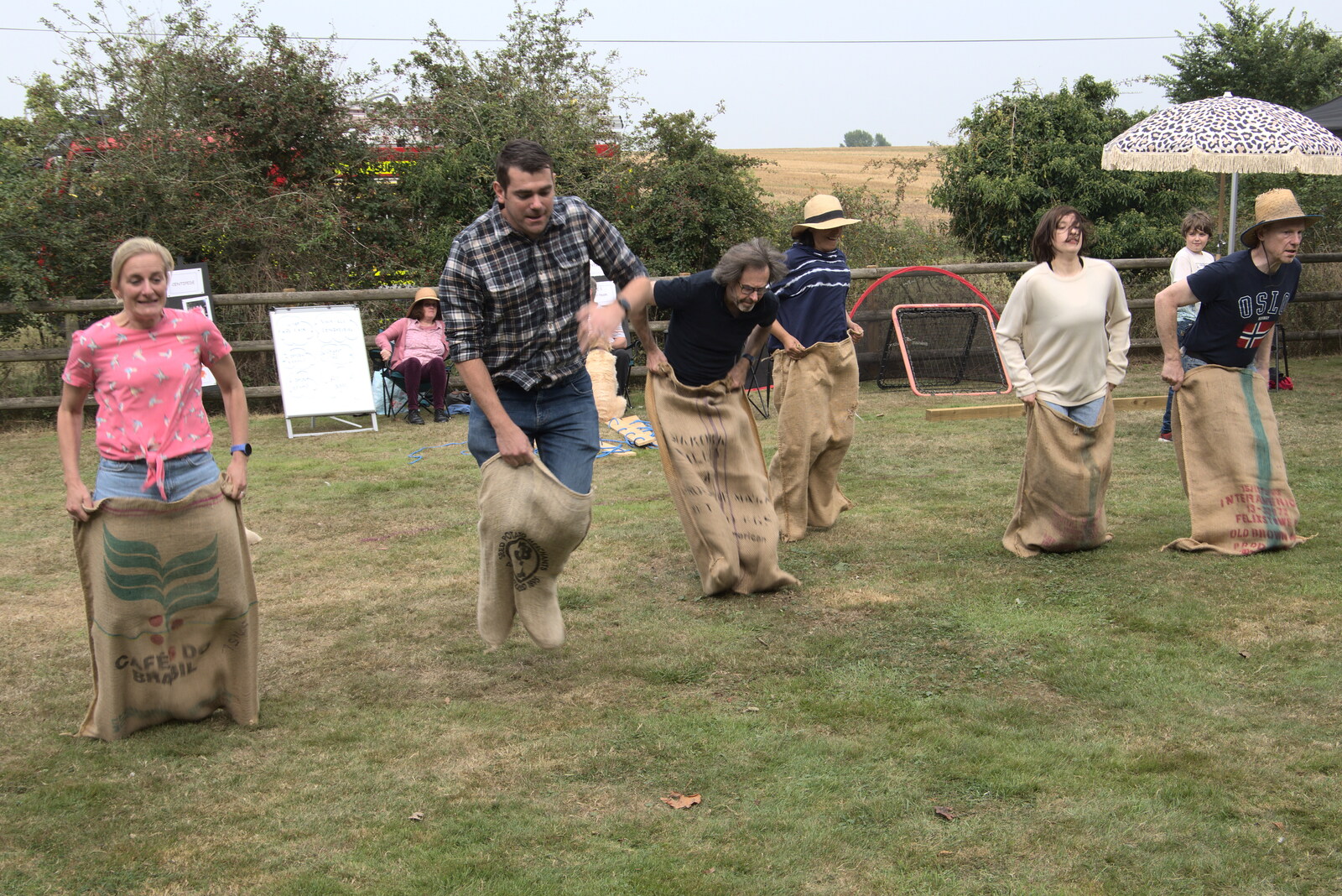 The adults' sack race occurs from The Brome and Oakley Fête, Oakley Hall, Suffolk - 19th September 2021