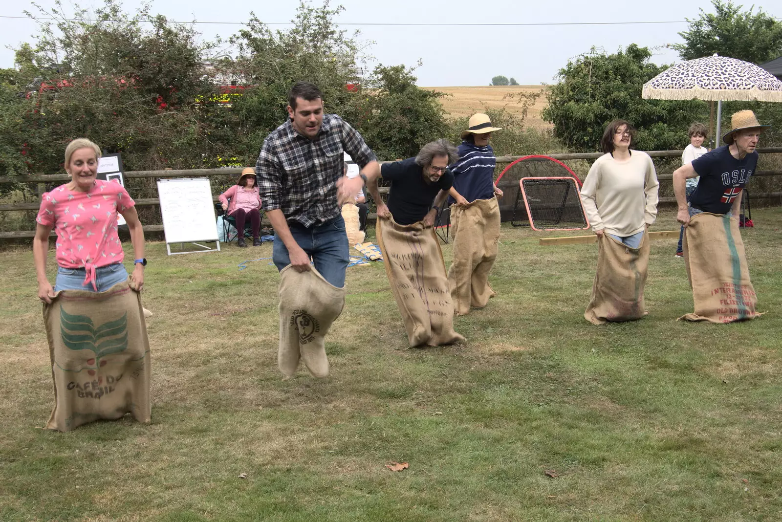 The adults' sack race occurs, from The Brome and Oakley Fête, Oakley Hall, Suffolk - 19th September 2021