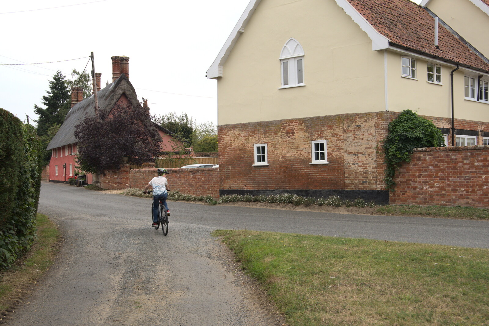 Fred heads off on his bike from The Brome and Oakley Fête, Oakley Hall, Suffolk - 19th September 2021