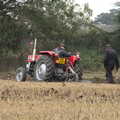 A tractor spins its wheels in the mud, Vintage Tractor Ploughing, Thrandeston, Suffolk - 26th September 2021