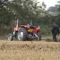 A tractor spins its wheels in the mud, Vintage Tractor Ploughing, Thrandeston, Suffolk - 26th September 2021