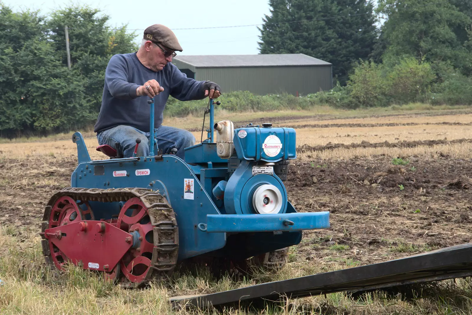 The Ransome's micro tractor is driven up a ramp, from Vintage Tractor Ploughing, Thrandeston, Suffolk - 26th September 2021