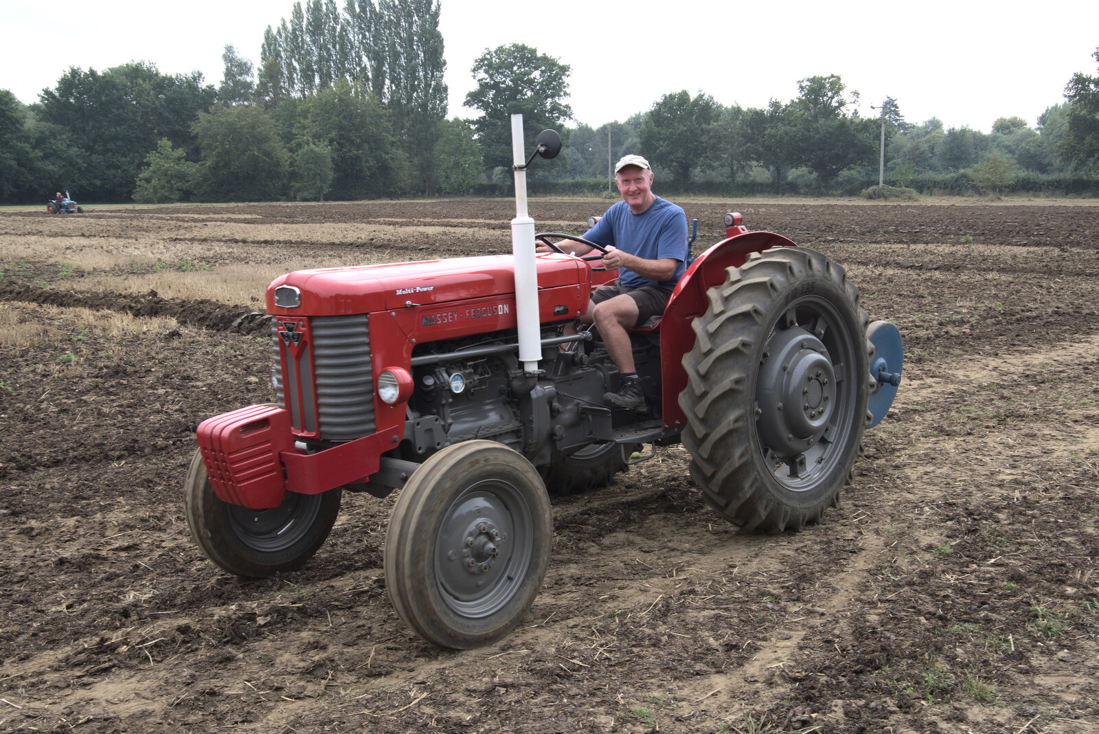 Vintage Tractor Ploughing, Thrandeston, Suffolk - 26th September 2021: A grin from a Massey Ferguson driver