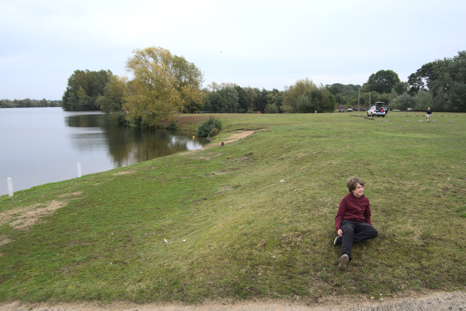 Fred sits on the bank of the lake from A Trip to Weybread Sailing Club, Harleston, Norfolk - 17th October 2021