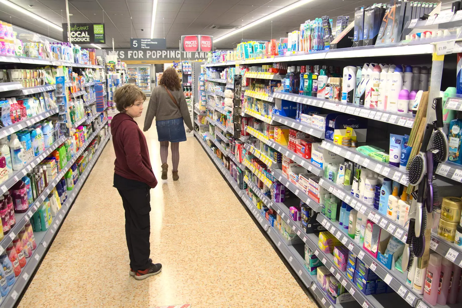 Fred looks at stuff in the Co-op, from A Trip to Weybread Sailing Club, Harleston, Norfolk - 17th October 2021