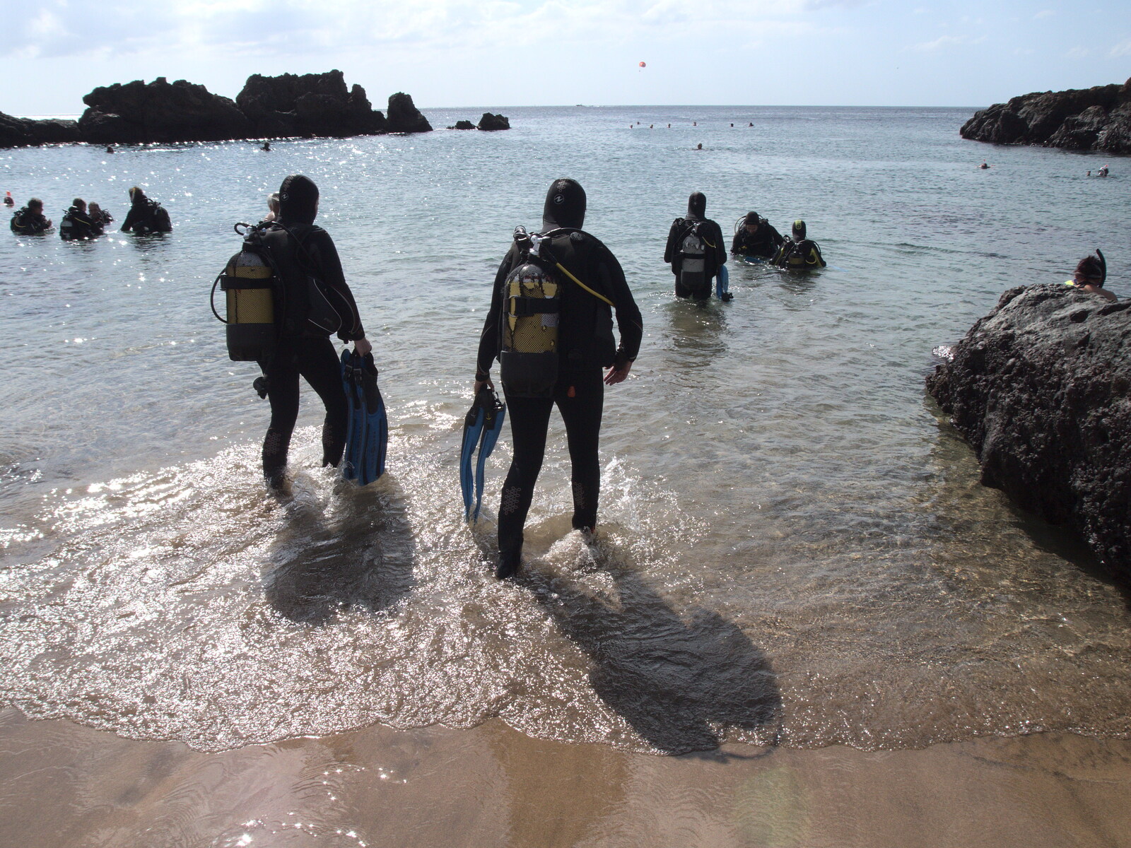 The divers head off into the sea from The Volcanoes of Lanzarote, Canary Islands, Spain - 27th October 2021