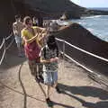 Isobel checks her watch against the bus schedule, The Volcanoes of Lanzarote, Canary Islands, Spain - 27th October 2021