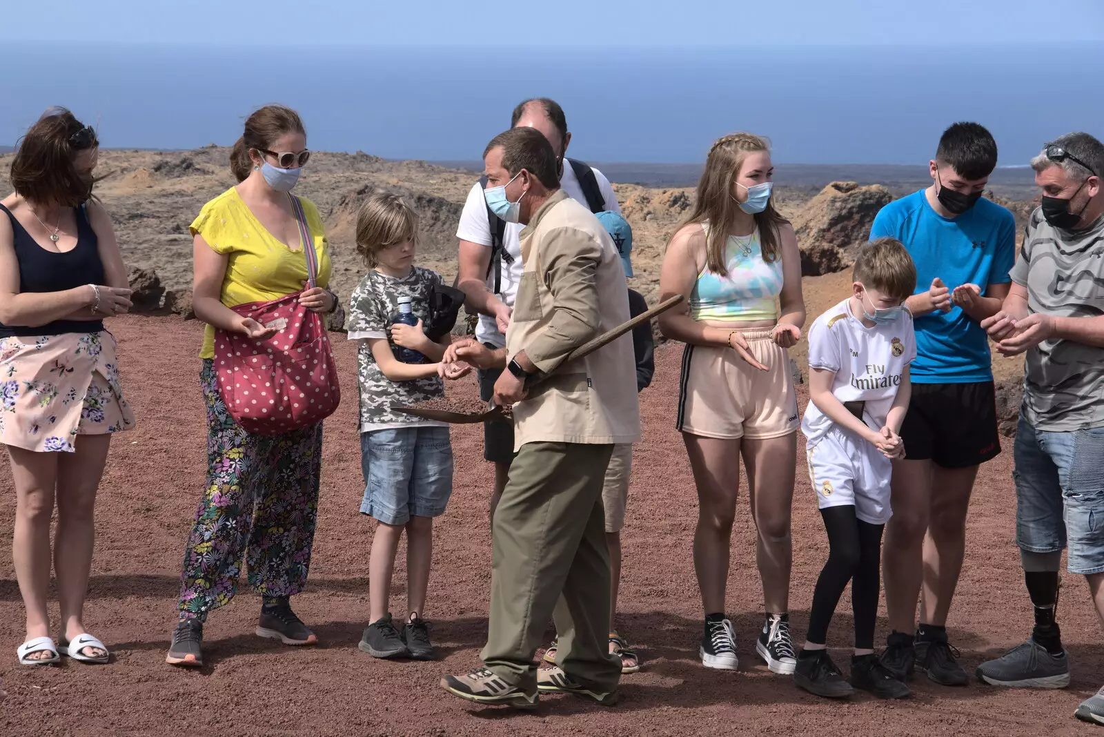 Harry gets handed some hot rocks, from The Volcanoes of Lanzarote, Canary Islands, Spain - 27th October 2021