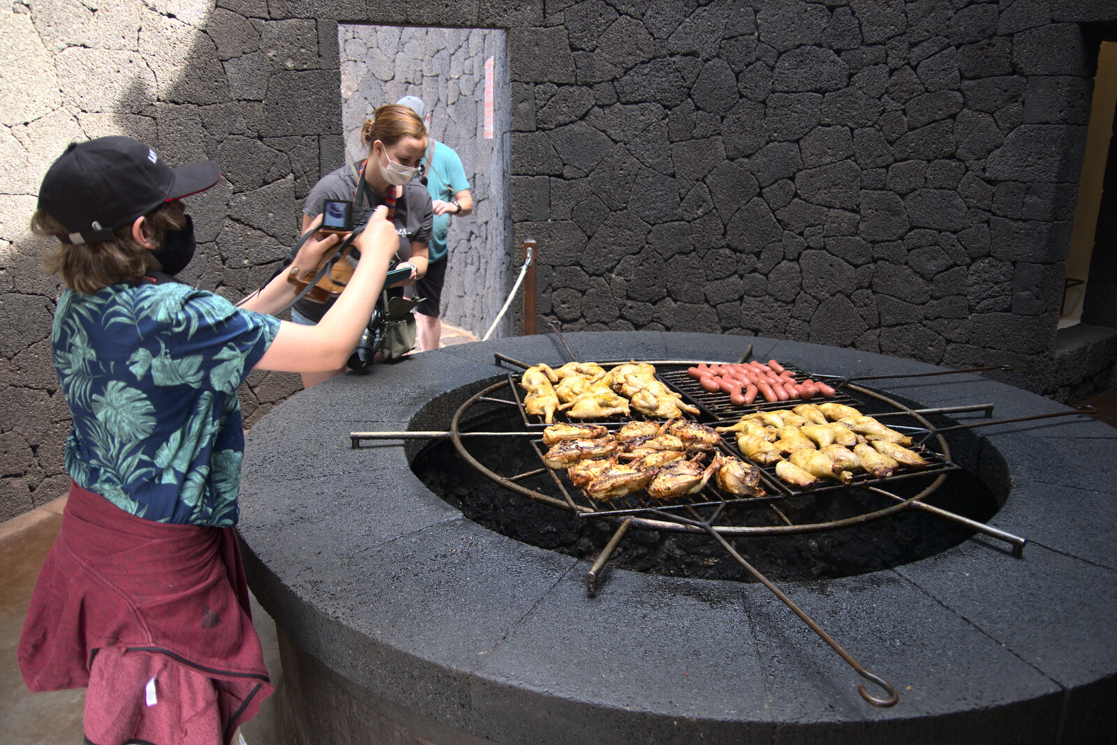 Food cooks over actual volcanic hot rocks from The Volcanoes of Lanzarote, Canary Islands, Spain - 27th October 2021