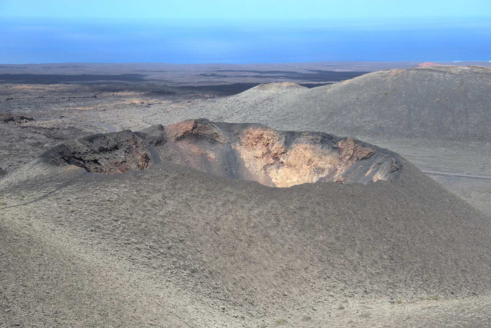 A volcanic crater with its top blown off from The Volcanoes of Lanzarote, Canary Islands, Spain - 27th October 2021