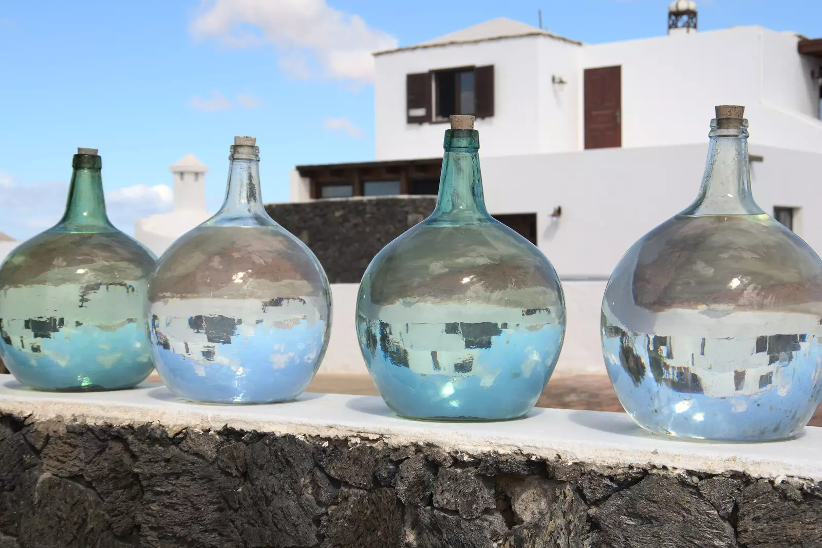 Bottles of water on a wall, from The Volcanoes of Lanzarote, Canary Islands, Spain - 27th October 2021