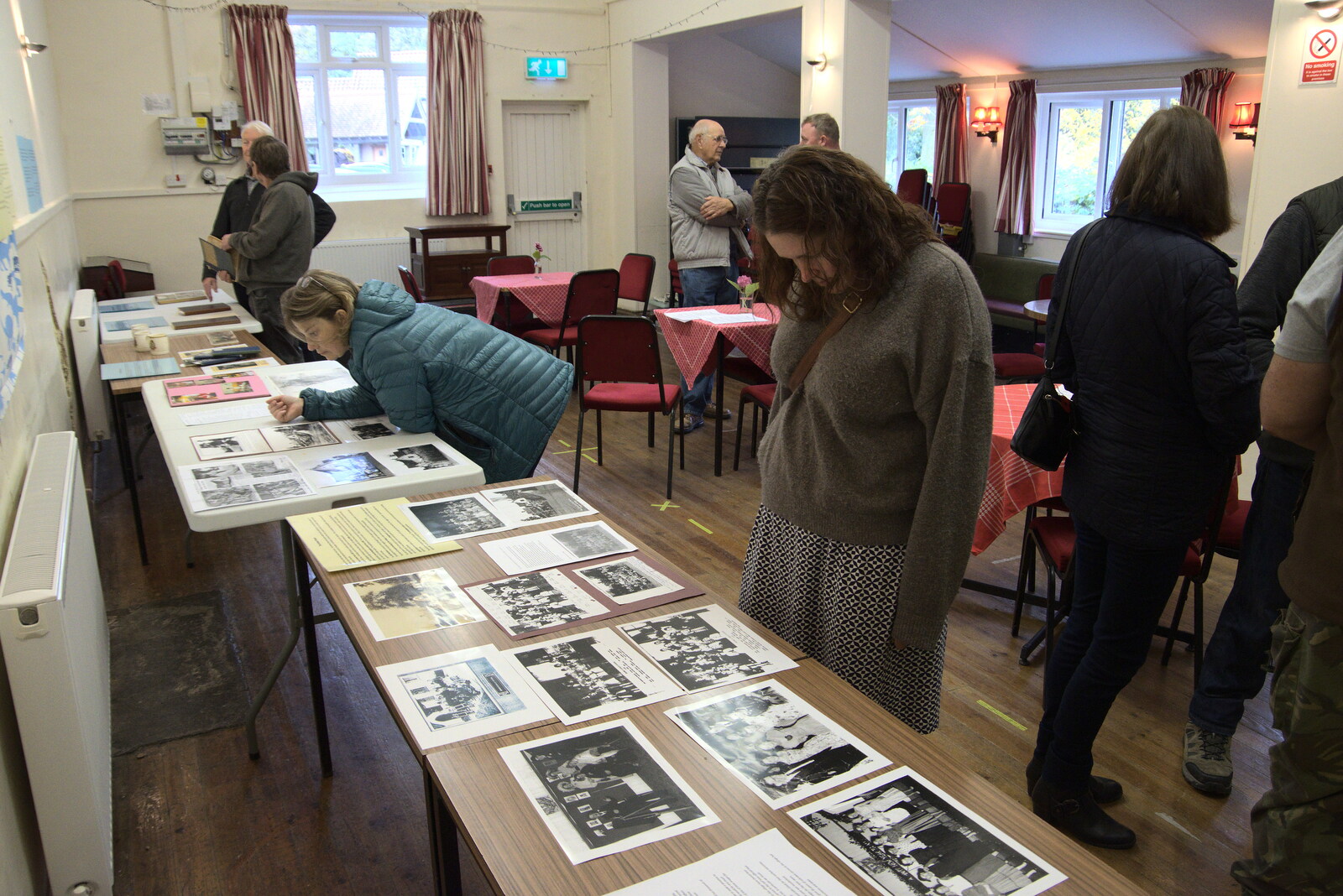 Isobel scopes out the photo collection from Brome Village Hall's 50th Anniversary, Brome, Suffolk - 12th November 2021