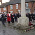 A policeman lays a wreath, The GSB and Remembrance Day Parades, Eye and Botesdale, Suffolk - 14th November 2021