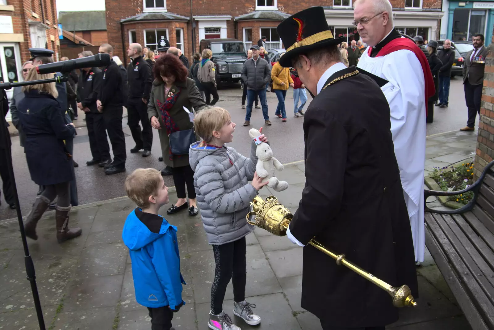 A girl shows off her toy rabbit to the mace bearer, from The GSB and Remembrance Day Parades, Eye and Botesdale, Suffolk - 14th November 2021