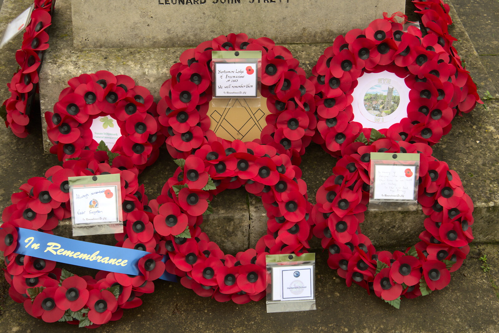 Poppy wreaths at the foot of the memorial from The GSB and Remembrance Day Parades, Eye and Botesdale, Suffolk - 14th November 2021