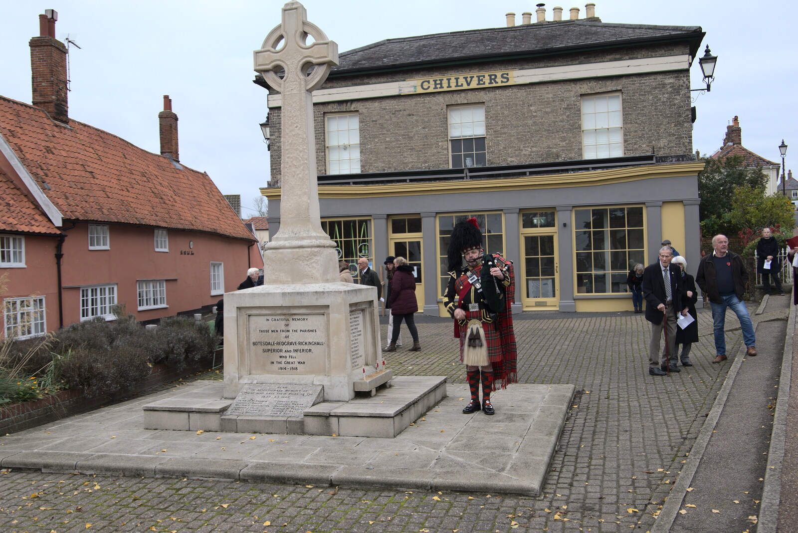 There's a lone piper by Botesdale war memorial from The GSB and Remembrance Day Parades, Eye and Botesdale, Suffolk - 14th November 2021