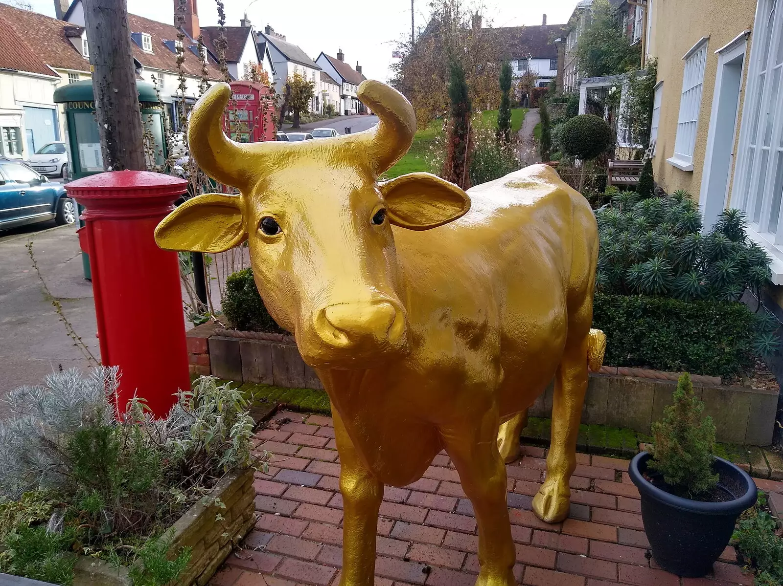 A golden cow outside Palfrey and Hall, from Dove Players' Trouble in Pantoland, Eye Community Centre, Suffolk - 11th December 2021