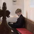 Harry sits in the choir and plays on a tablet, GSB Carols and Beer With the Lads, Thornham and Thorndon, Suffolk  - 18th December 2021