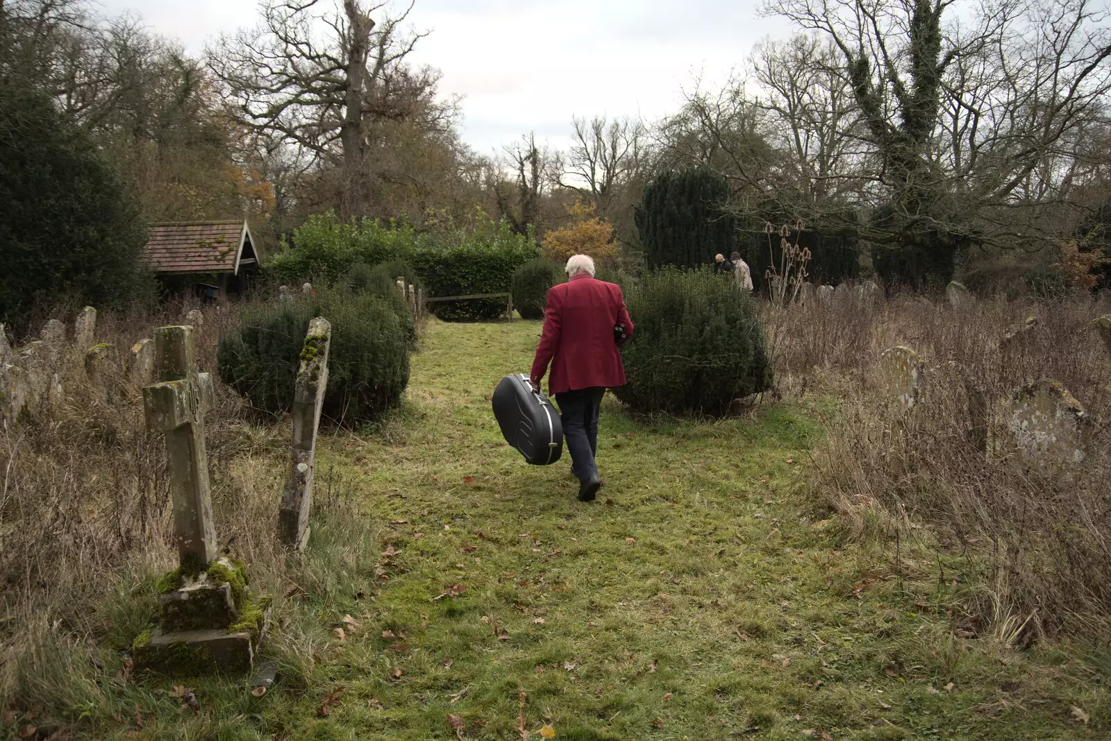 A horn player leaves the church , from GSB Carols and Beer With the Lads, Thornham and Thorndon, Suffolk  - 18th December 2021