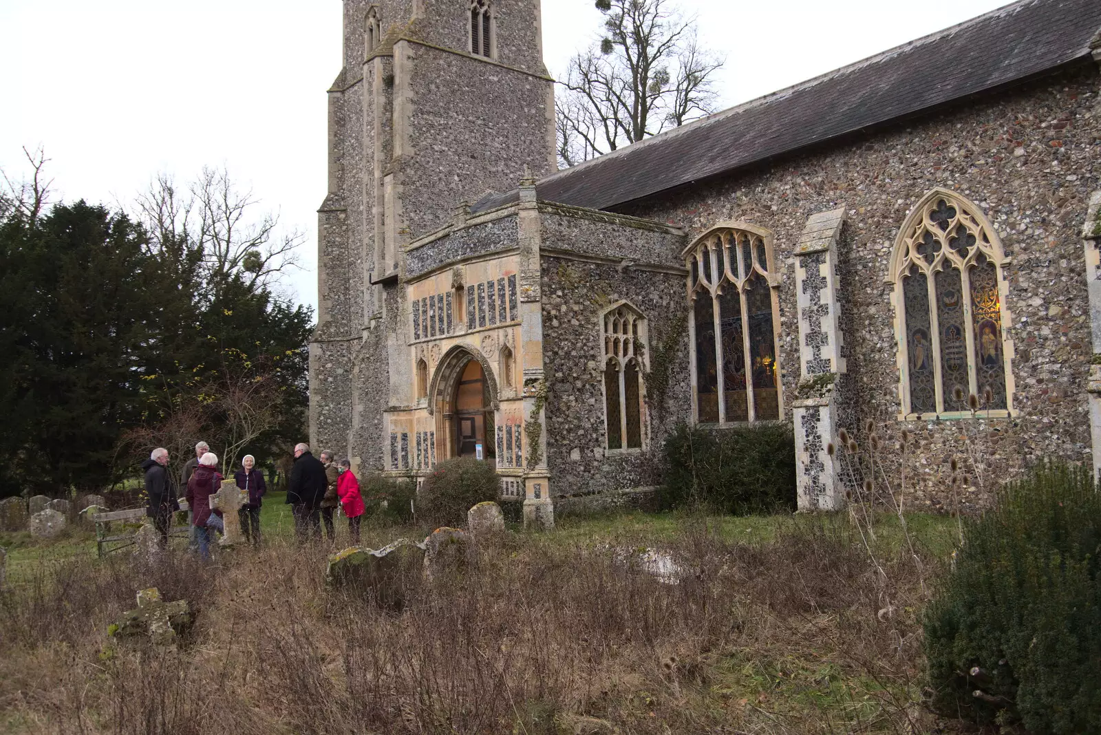 A small group hangs around outside the church, from GSB Carols and Beer With the Lads, Thornham and Thorndon, Suffolk  - 18th December 2021