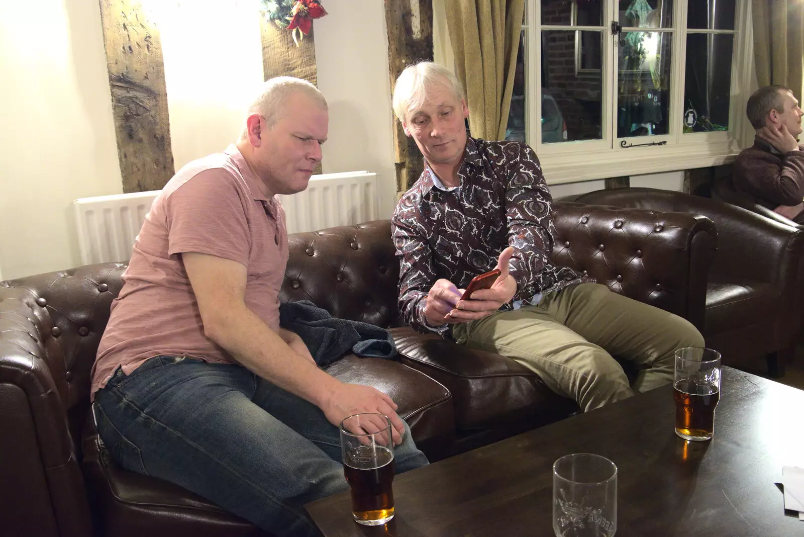 Jimmy shows Bill something on his phone, from GSB Carols and Beer With the Lads, Thornham and Thorndon, Suffolk  - 18th December 2021