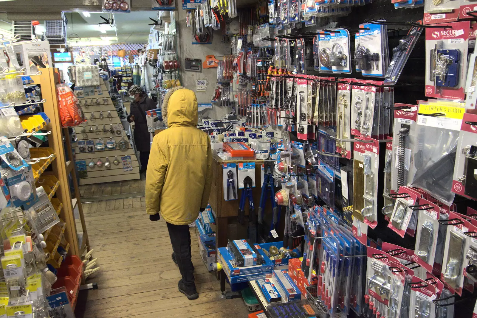 Harry roams around in the hardware shop, from GSB Carols and Beer With the Lads, Thornham and Thorndon, Suffolk  - 18th December 2021