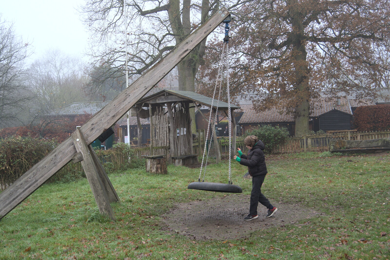 Fred takes on the tyre swing from A Return to Thornham Walks, Thornham, Suffolk - 19th December 2021